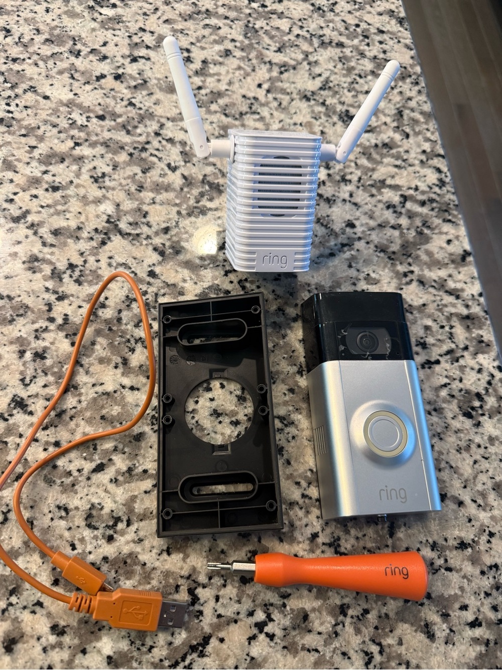 Ring Silver and Black Video Doorbell with White Extender and Orange Accessories